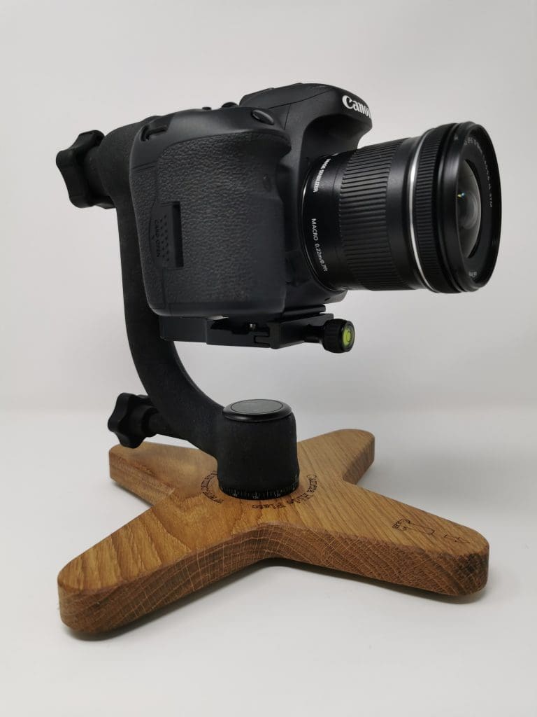 side view of the camera hide plate supporting a gimbal to which is attached a DSLR with macro lens